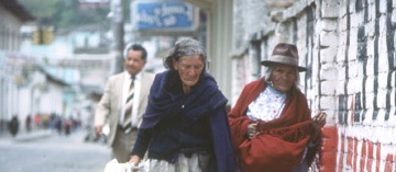 Two elderly women walking on a street in Otavalo, Ecuador, 1984