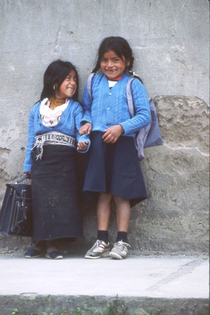 Two shy but happy schoolgirls